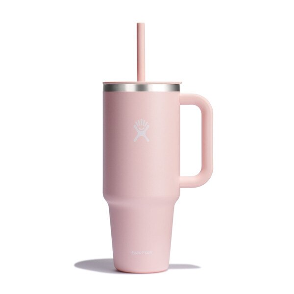 A pink, forty ounce tumbler with a handle and the white Hydro Flask logo on the front.